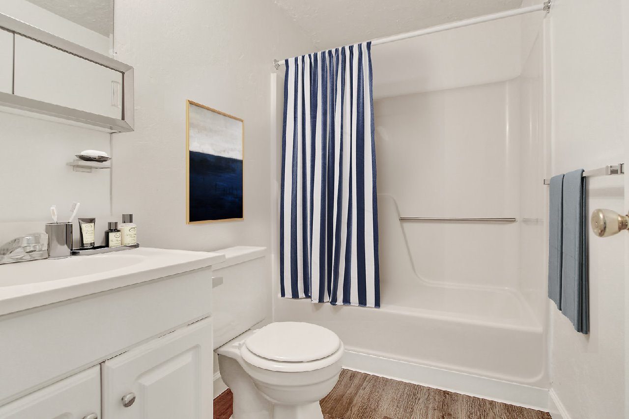 A dining room with a table and chairs.