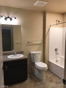 a bathroom with a sink toilet and bathtub