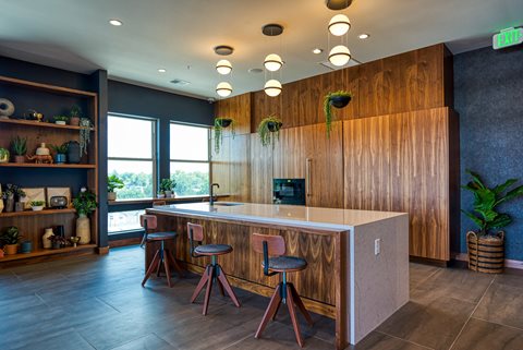 a kitchen with wood cabinets and a white counter top