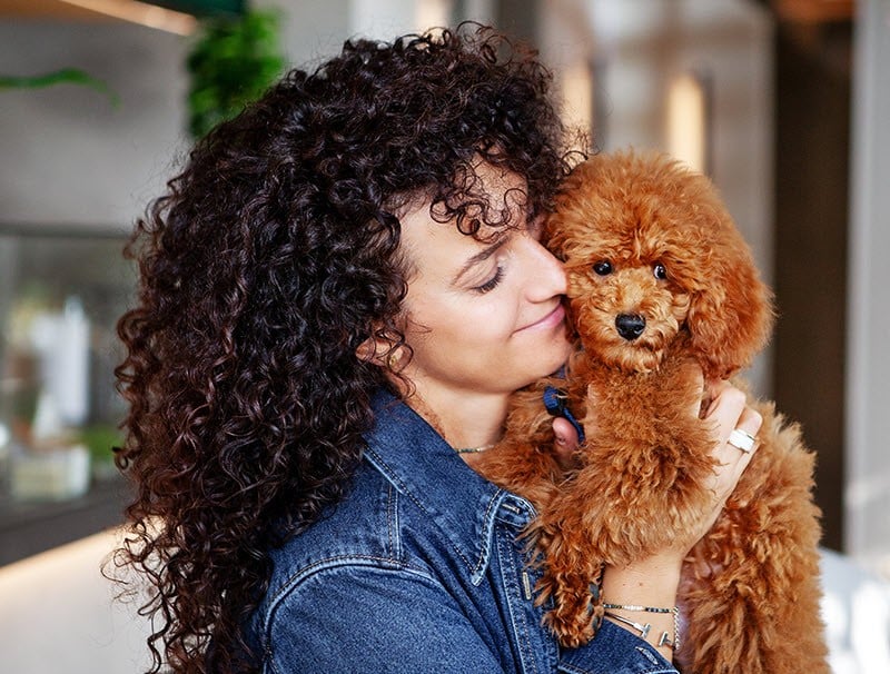 Woman holding dog