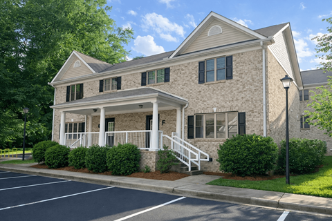 A building with a front porch and a covered entrance.