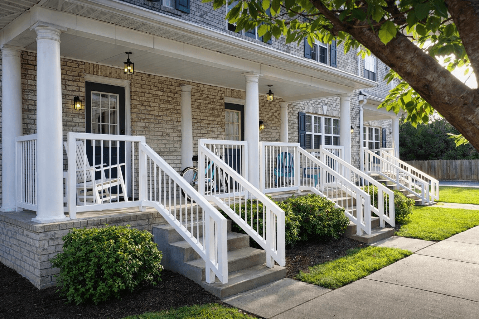 A house with a white porch and stairs.