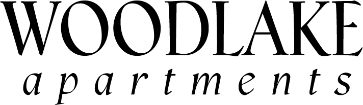 The image displays the text "WOODLAKE apartments" in a large, bold font.