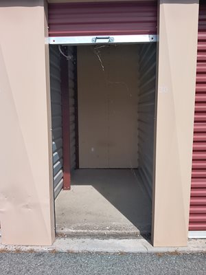 A red garage door with a number 30 on the side.