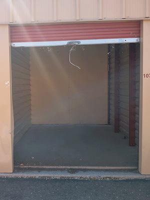 A storage unit with the door open and number 10 visible.