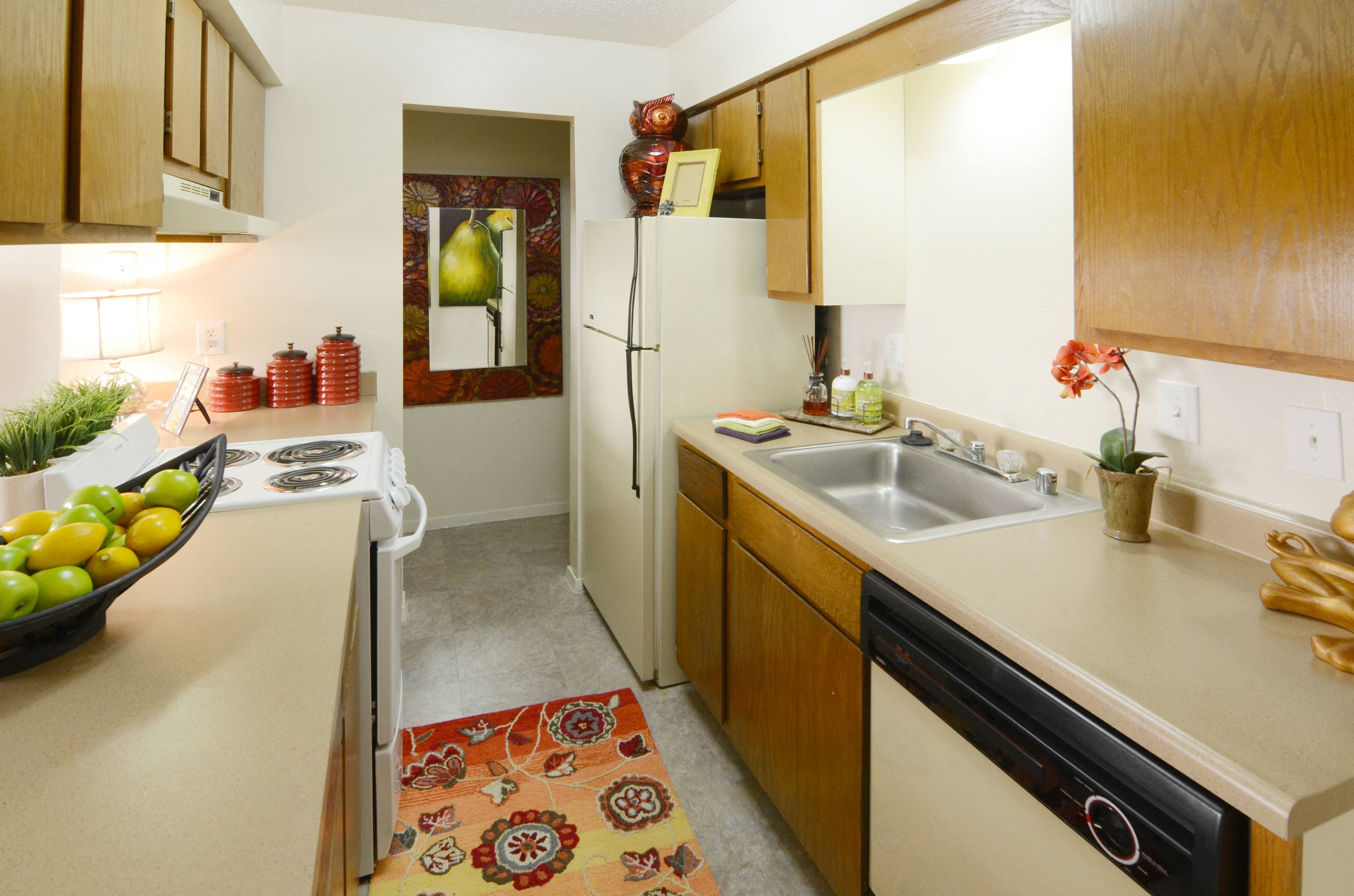 a kitchen with a sink and a refrigerator