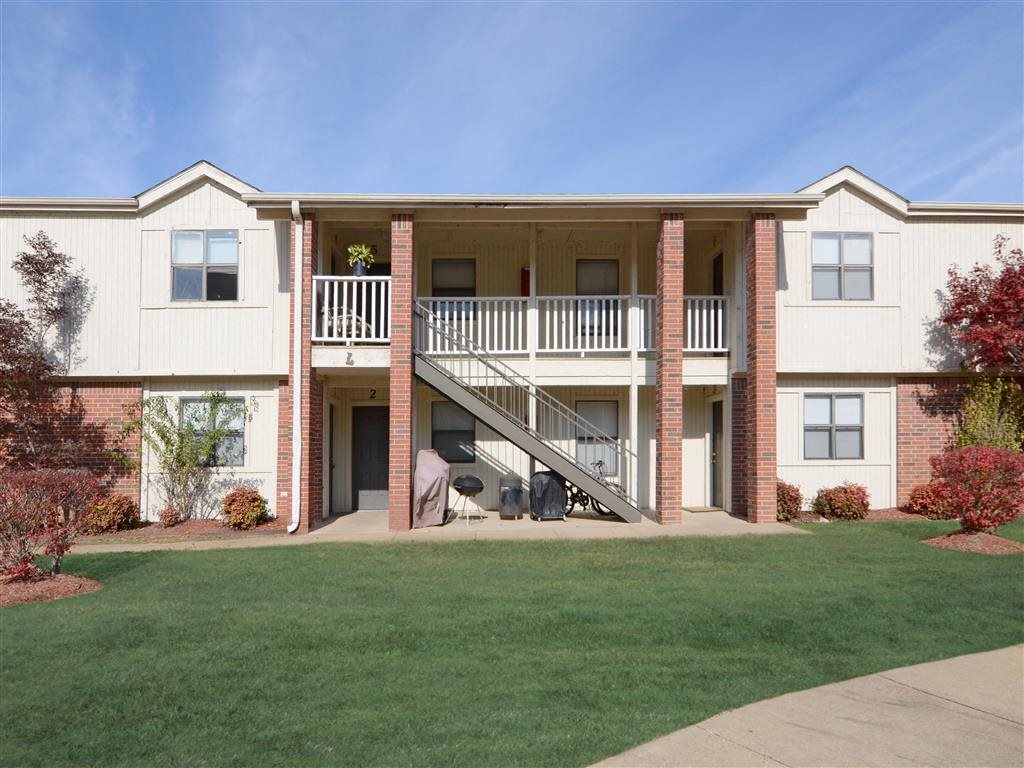 a view of the exterior of an apartment building with a staircase
