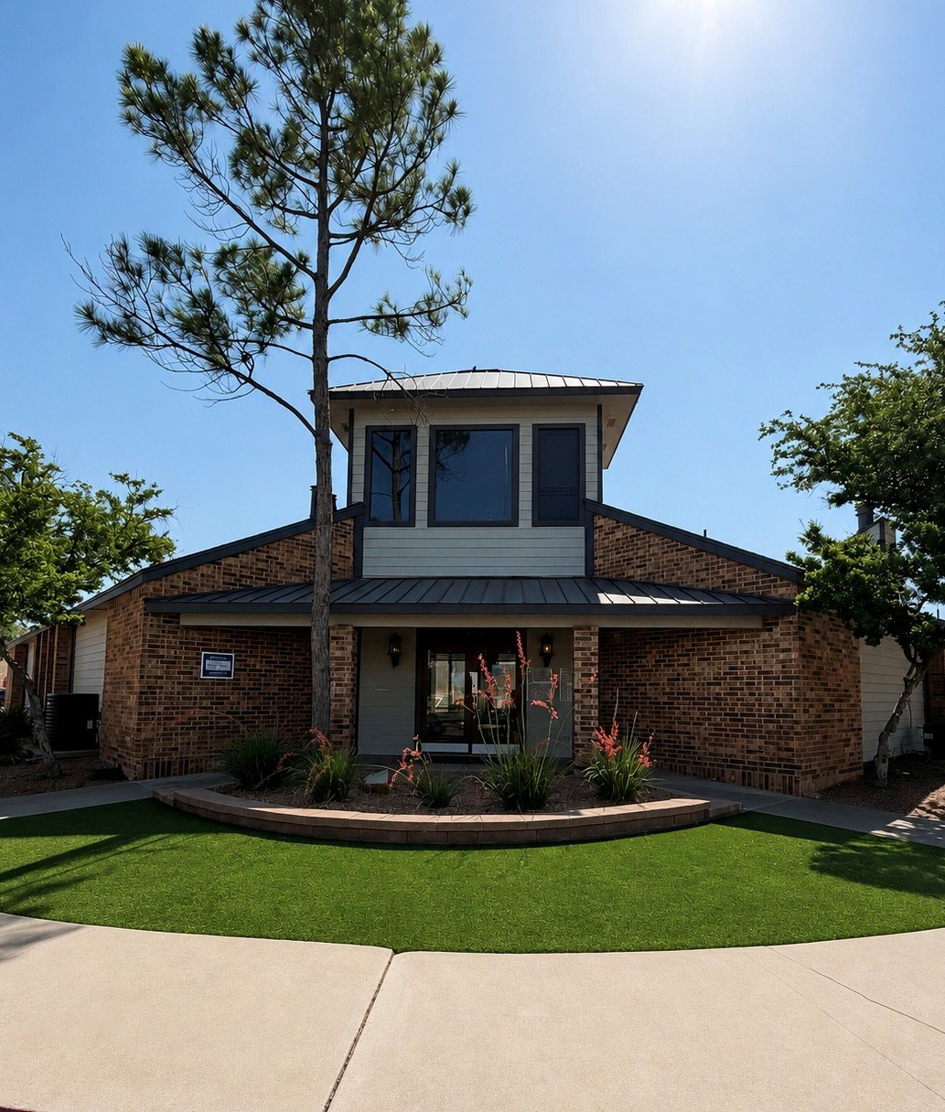 A house with a tree in front of it.