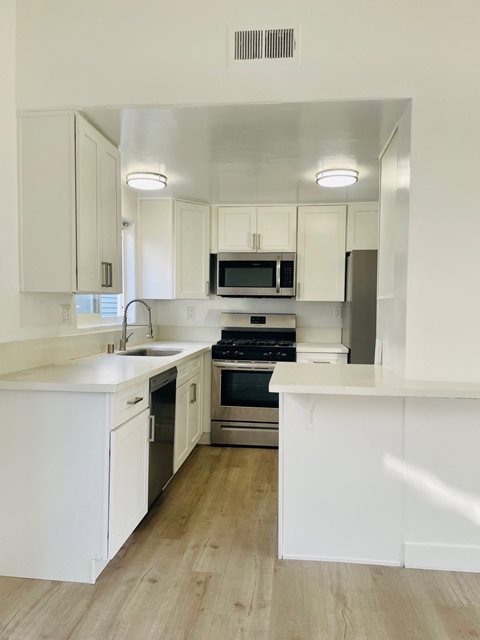 Kitchen with White Cabinets and Stainless Steel Appliances