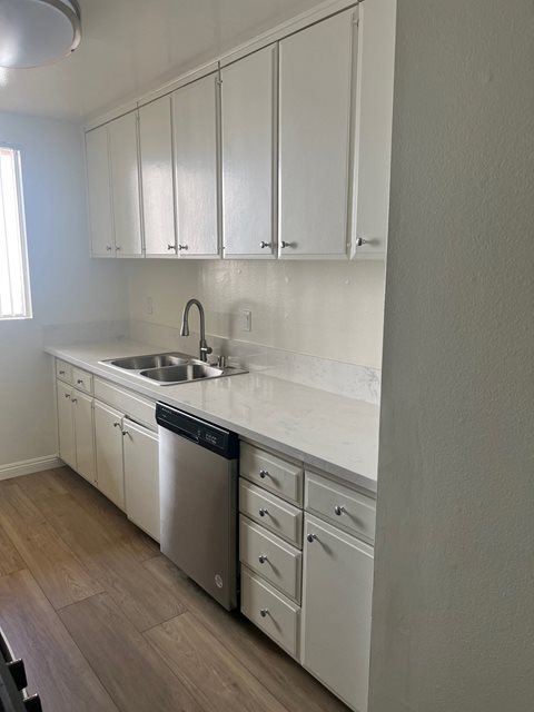 Kitchen with Stainless Steel Appliances and White Cabinets