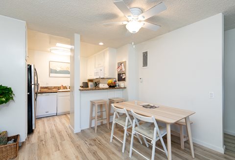 Dining Room with Hardwood Floors and Fan