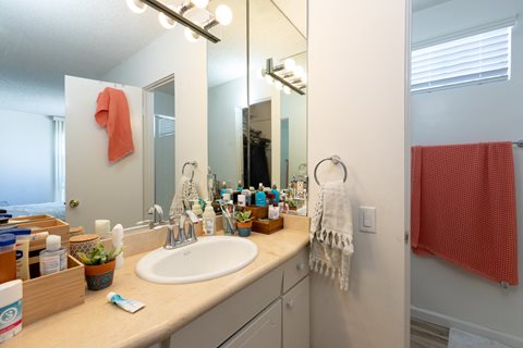 En Suite Bathroom with White Cabinets