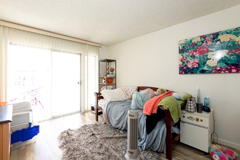 Bedroom with Hardwood Floors and Patio Doors