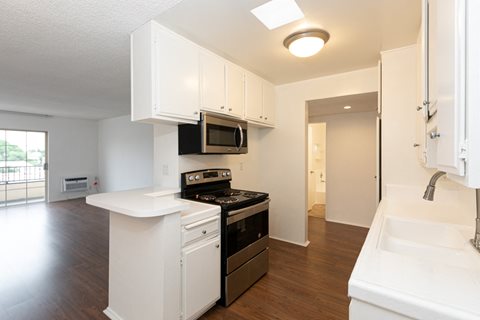 Kitchen with Stainless Steel Appliances and White Cabinets