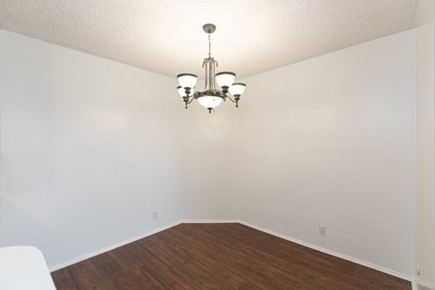 Dining Room with Hardwood Floors and Chandelier