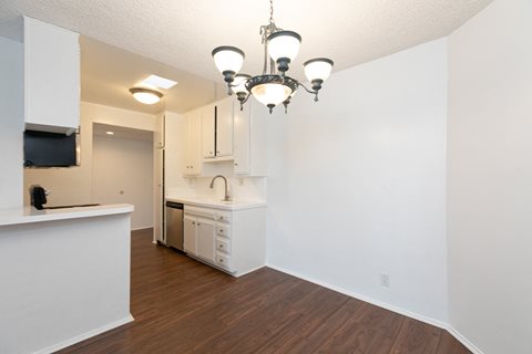 Dining Room with Hardwood Floors and Chandelier