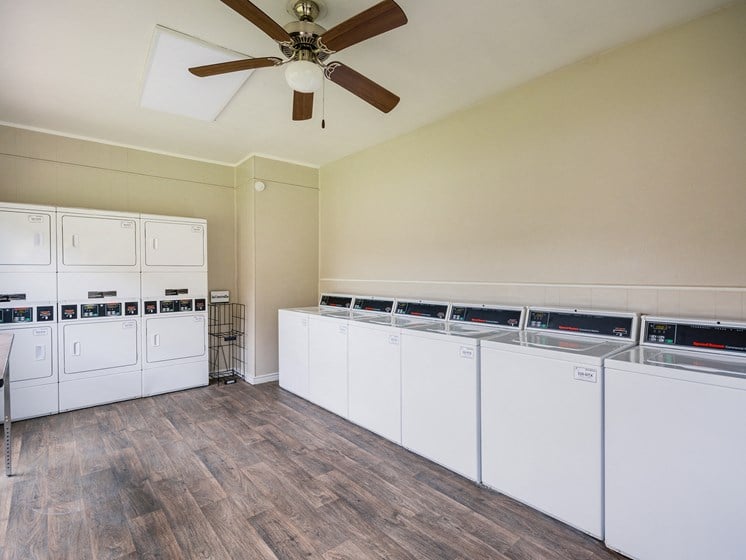 Laundry Room at Bookstone and Terrace Apartments in Irving, Texas