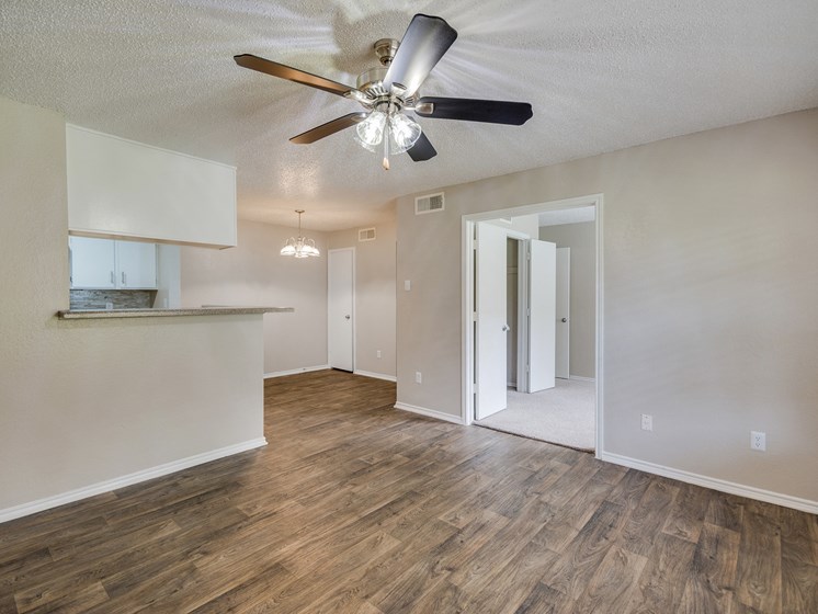 Living Area with Ceiling Fan at Bookstone and Terrace Apartments in Irving, Texas