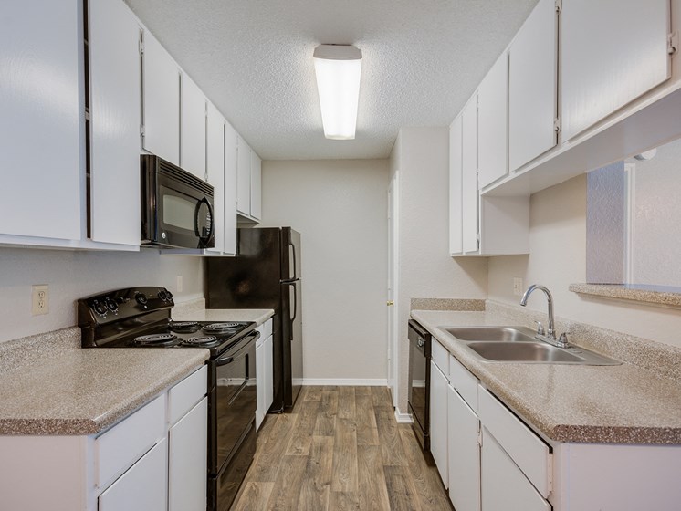 Model Kitchen at Bookstone and Terrace Apartments in Irving, Texas