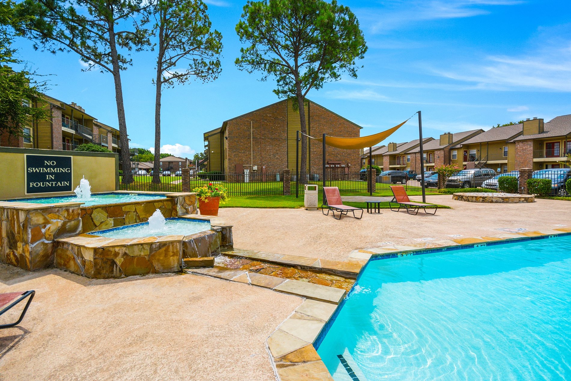 Swimming Pool Area at Bookstone and Terrace Apartments in Irving, Texas
