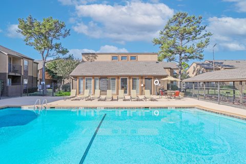 Our sparkling swimming pool by the leasing office building at Stone Canyon apartments in Shreveport, LA.