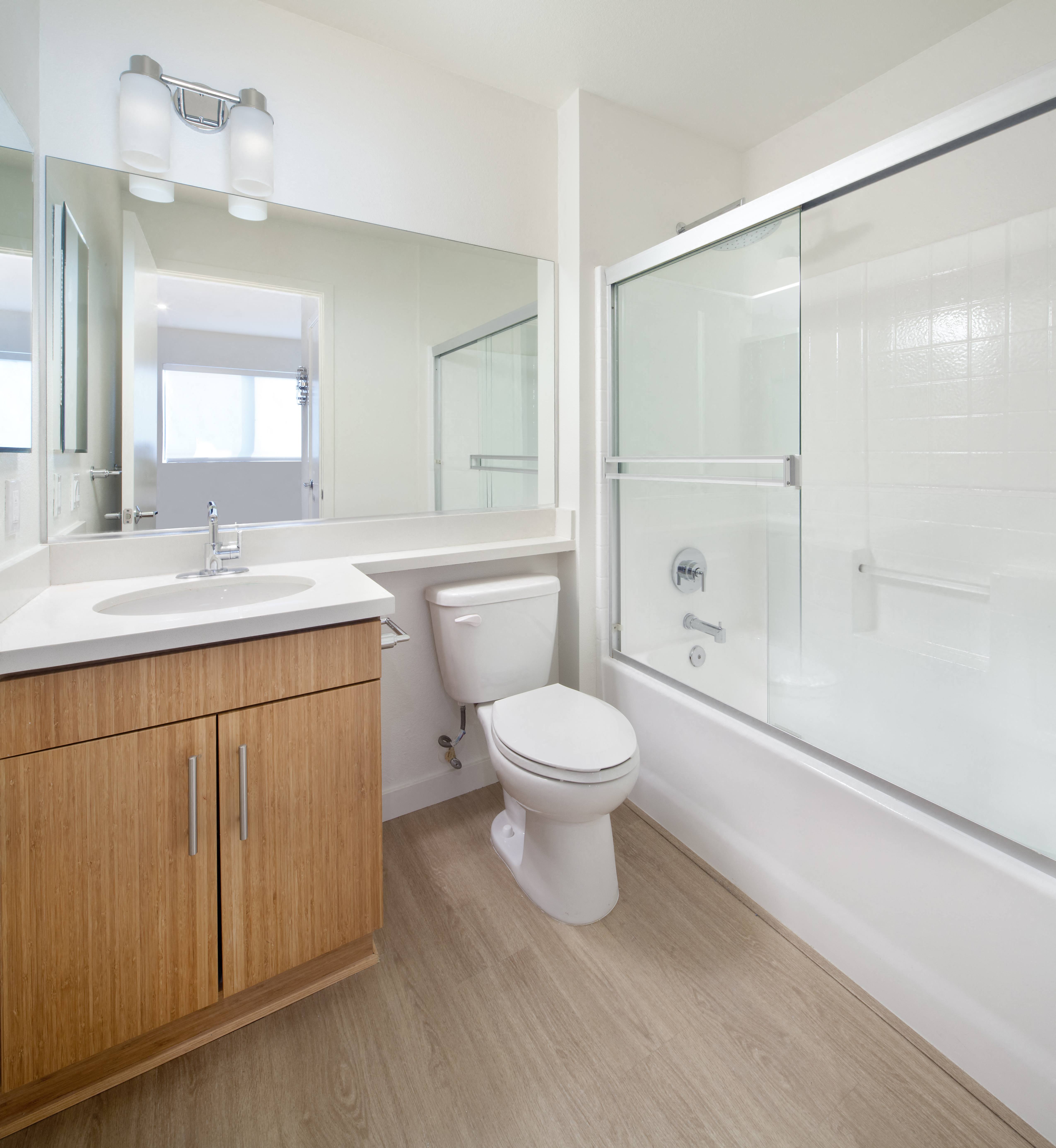 a bedroom with a bed and desk in a 555 waverly unit