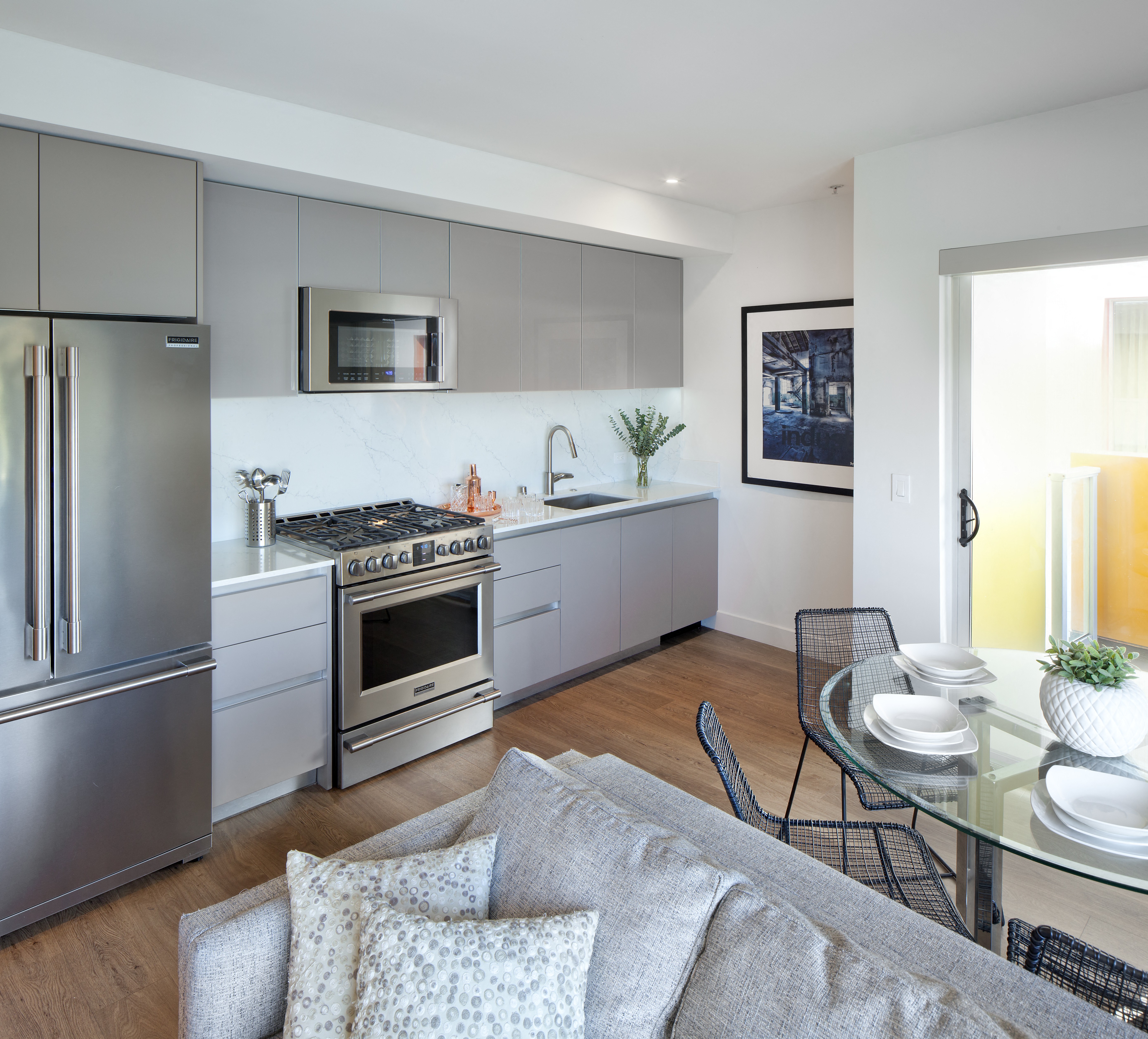 a kitchen and dining area in a 555 waverly unit