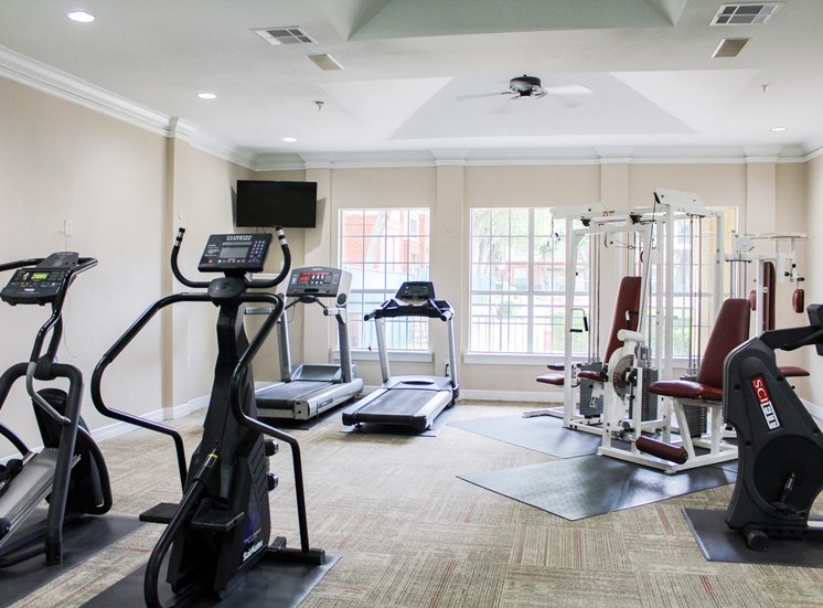 Montfort Place fitness center. Two treadmills, two cable machines, two cardio climber machines. one exercise bike. Montfort Place in North Dallas, TX, For Rent. Now leasing 1 and 2 bedroom apartments.