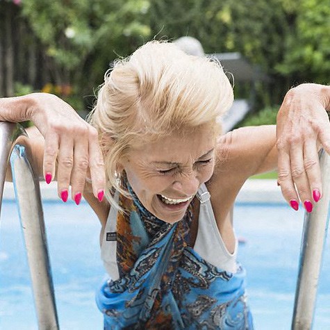 Woman enjoys an outdoor pool