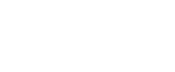 A sign that says Bixby Knolls Luxury Apartments.