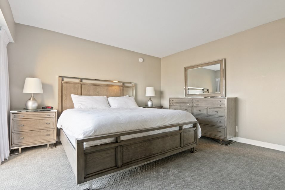 Remodeled Bedroom with carpet floorings