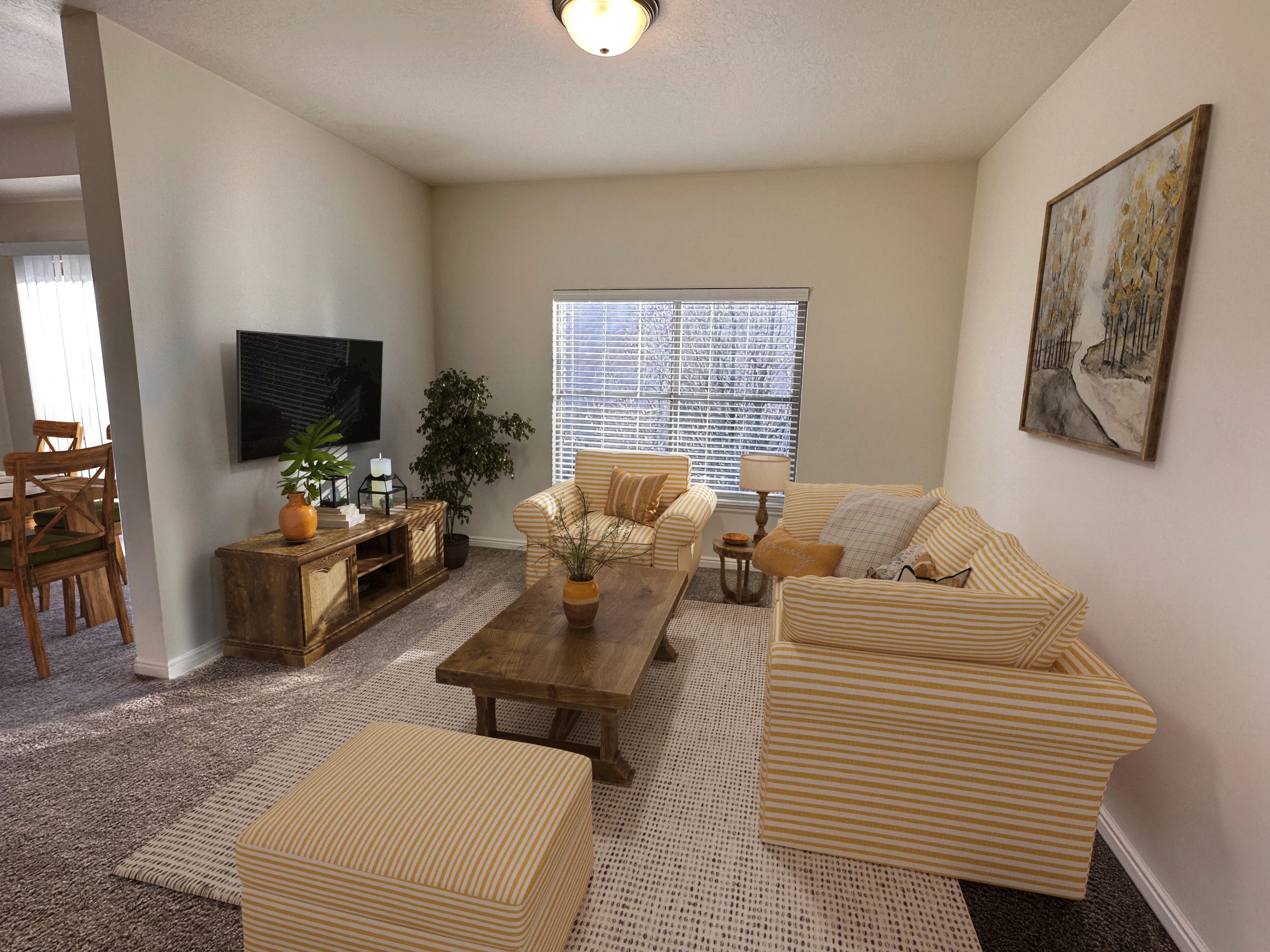Liberty Landing Apartments in West Jordan Utah living room in Midway floor plan with couch, coffee table and television.