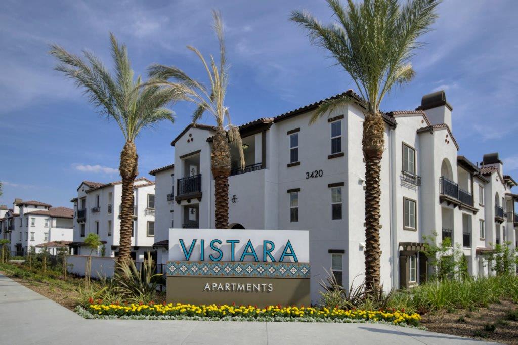 Vistara Apartments sign in front of the building, showcasing the community’s name and inviting atmosphere for prospective residents