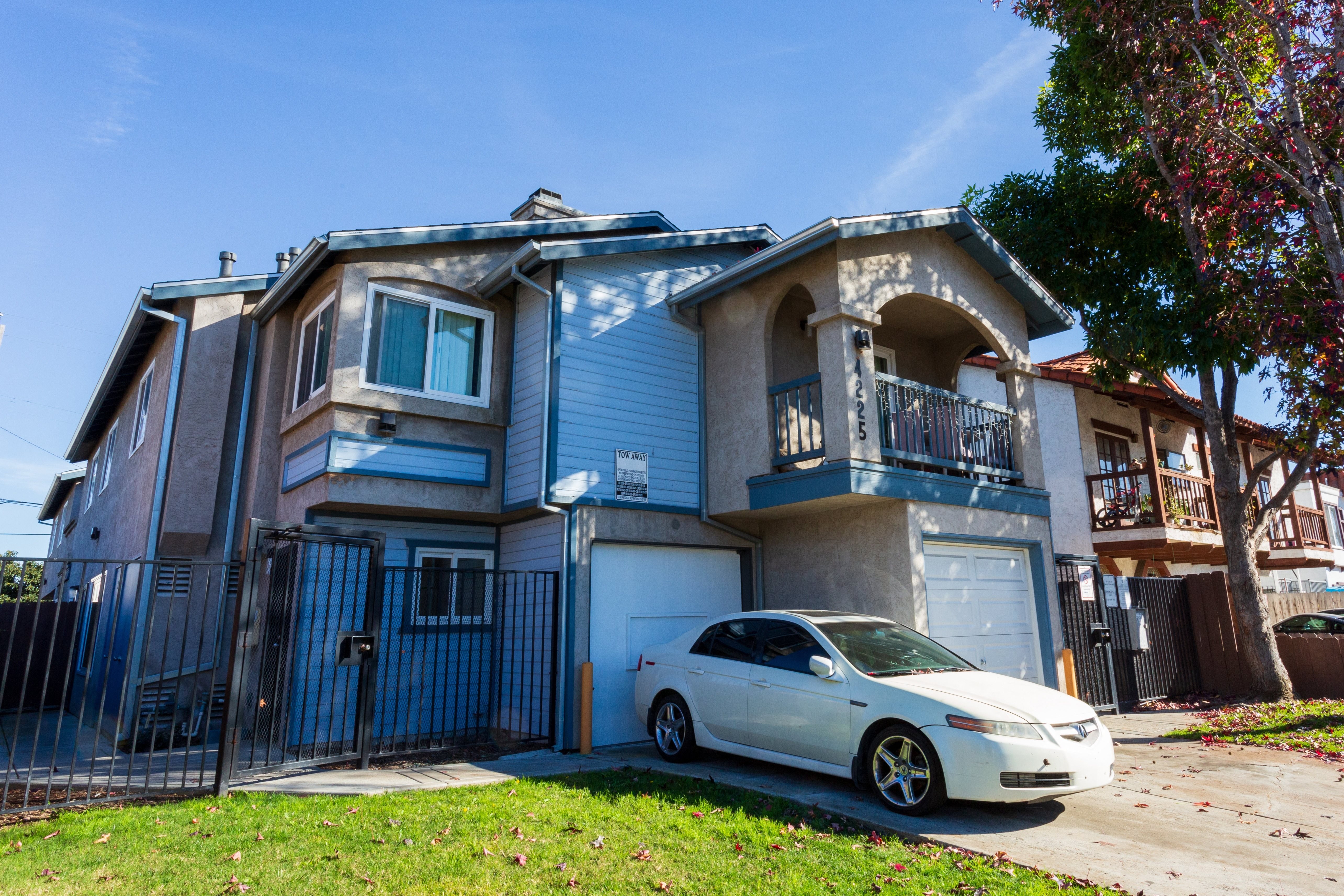 a house with a car parked outside of it