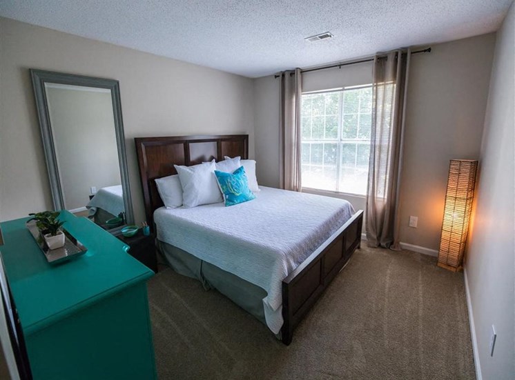 bedroom with large window and plush carpeting at Stillwater at Grandview Cove, Simpsonville