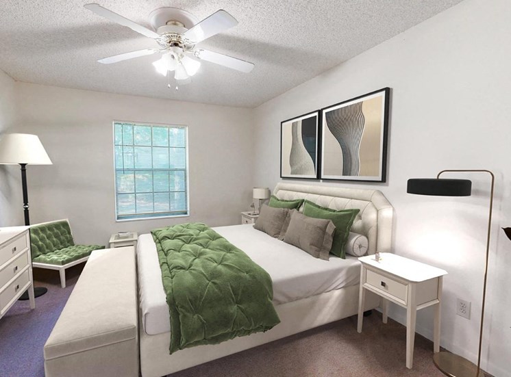bedroom with illuminated ceiling fan and model furnishings