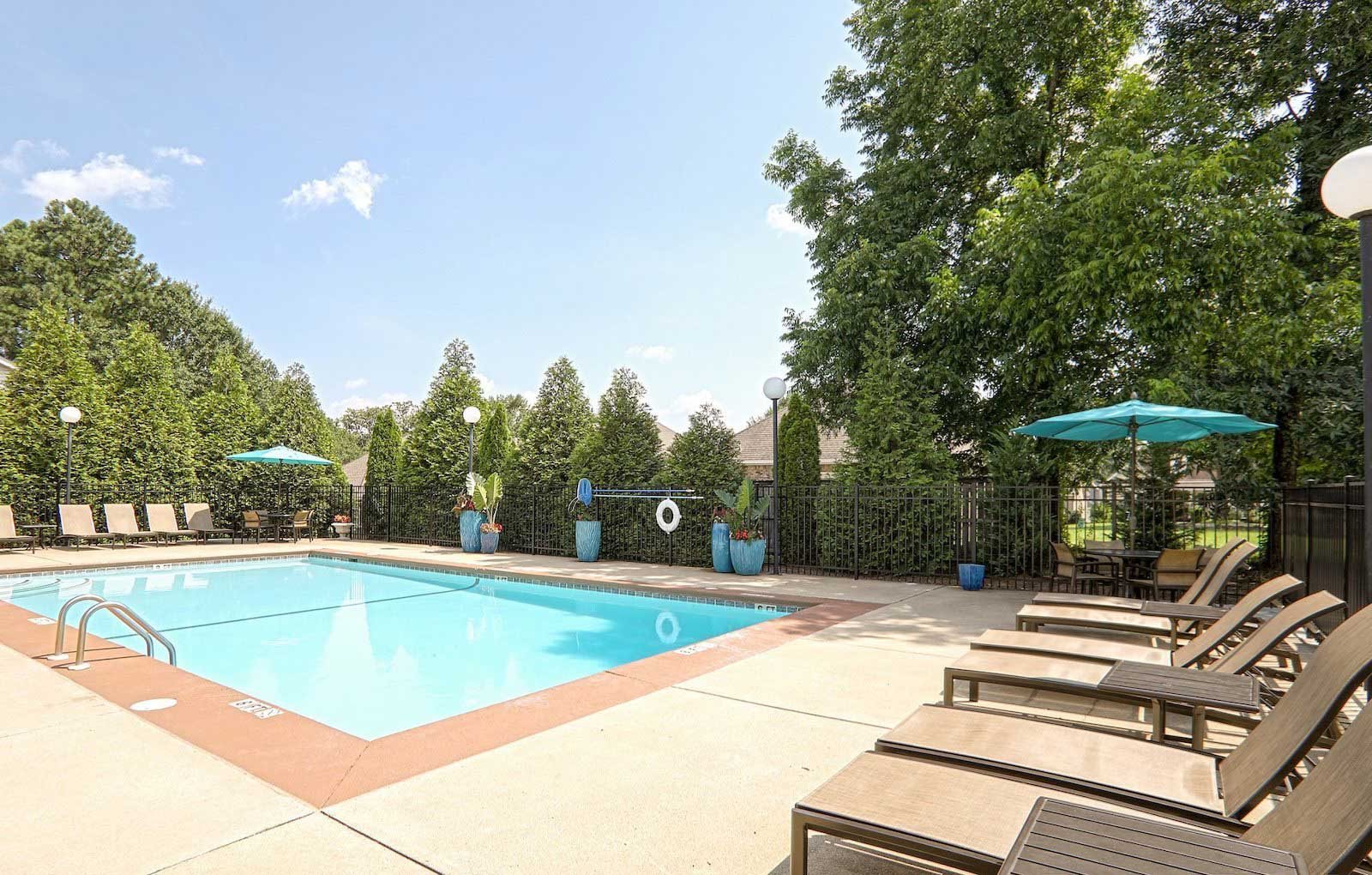 Swimming pool with sundeck and lounge furniture at The Point at Fairview Apartments, Prattville, Alabama