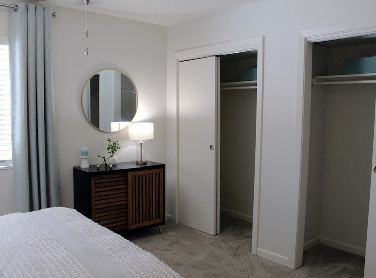 two double closets in bedroom with plush carpeting at Sherwood Park