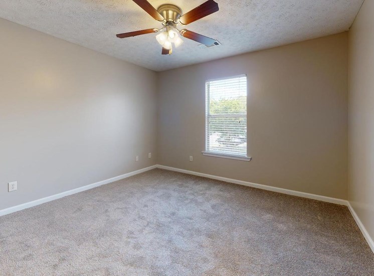 bedroom with window, plush carpeting, and illuminated ceiling fan