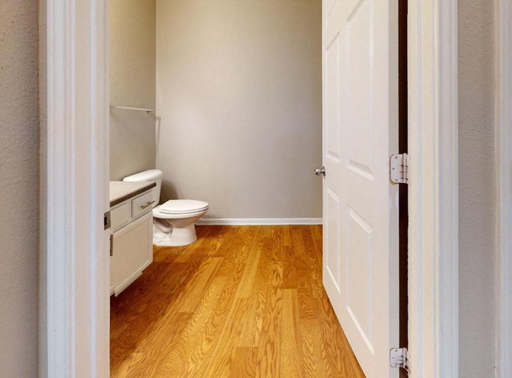 bathroom with wood-style flooring