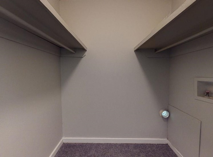 Walk-in closet with built in shelving at Reserve at Midtown Apartments in Tallahassee, Florida