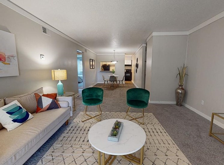 Model furnishings in living and dining room area at Reserve at Midtown Apartments in Tallahassee, Florida 32303
