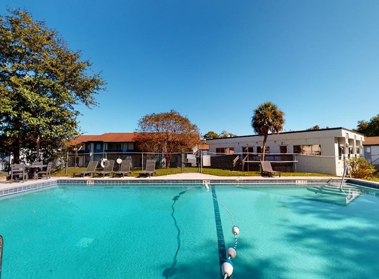 Large swimming pool and sundeck at Reserve at Midtown Apartments in Tallahassee, Florida 32303