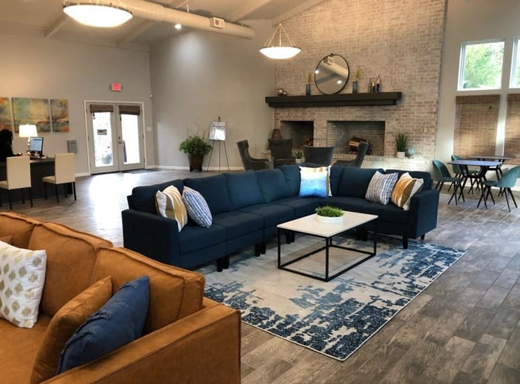 Comfortable couch seating in updated resident clubhouse at Aspen Run and Aspen Run II Apartments, Tallahassee, FL