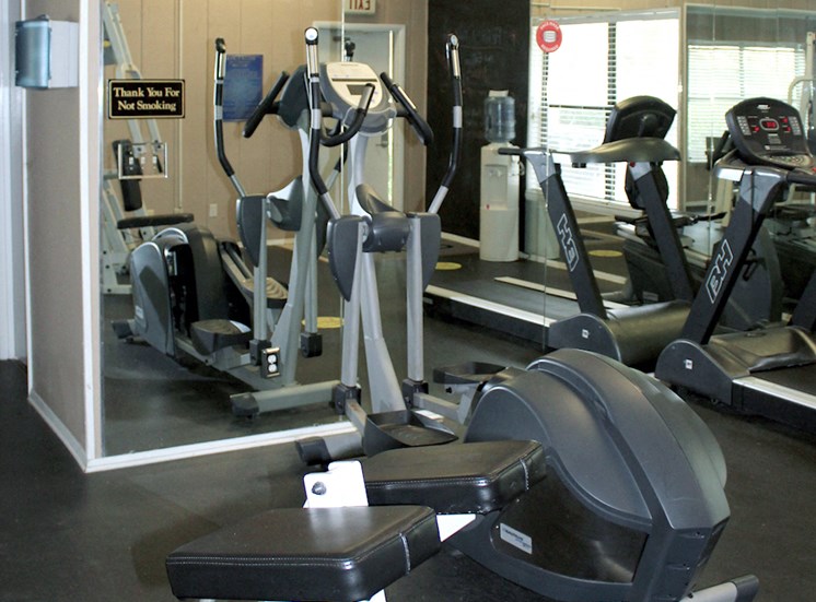 cardio equipment with large mirrors in fitness center at Zelda Pointe Apartments