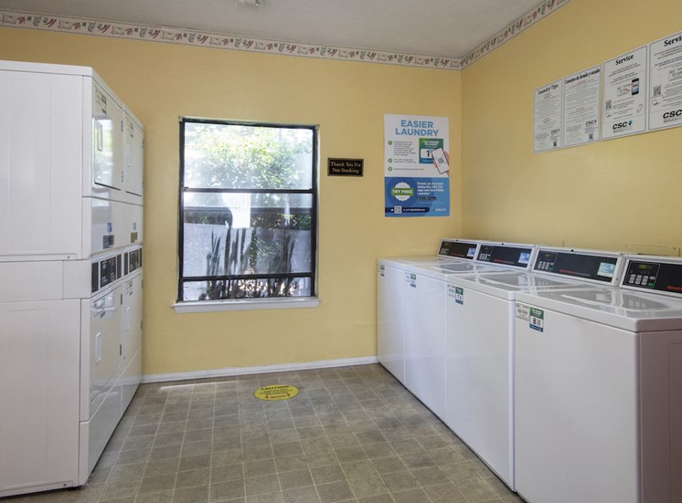 washers and dryers in laundry center at Zelda Pointe Apartments