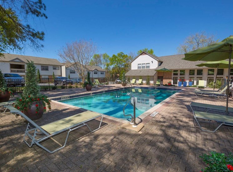 Pool and sundeck with lounge chairs at Aspen Run and Aspen Run II Apartments, Tallahassee, Florida