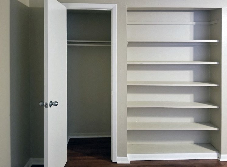 Pantry with built-in shelving and closet at Aspen Run