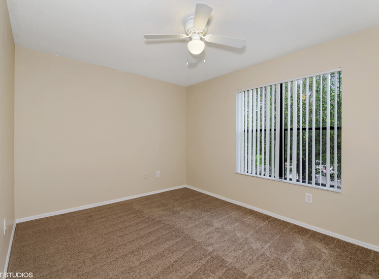 Bedroom with carpet flooring and multi speed ceiling fan