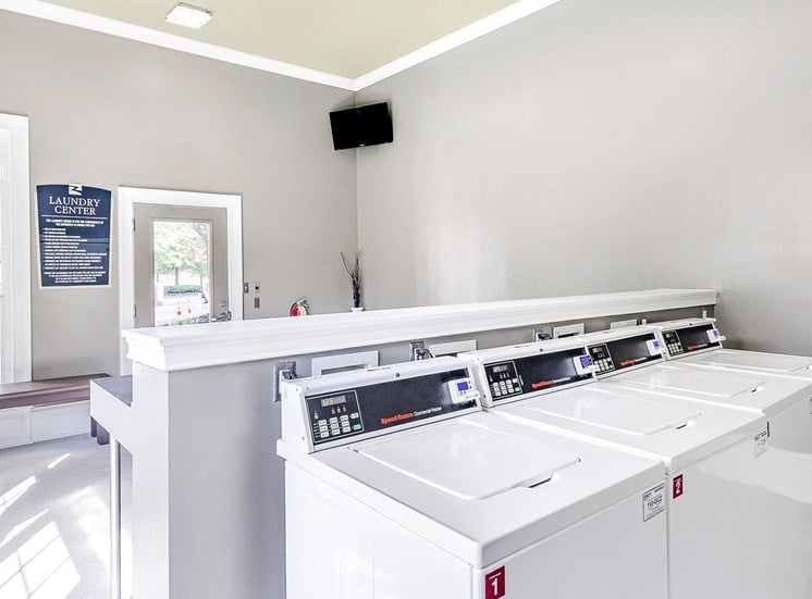 Laundry center with washer and dryers